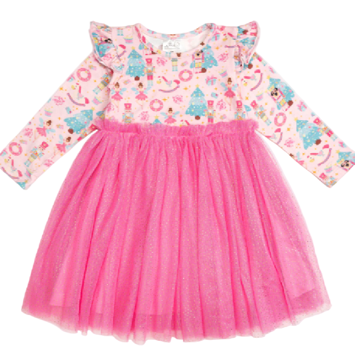 A girl's pink long-sleeve Christmas tutu dress with a nutcracker and angel print bodice and a bright pink tulle skirt.