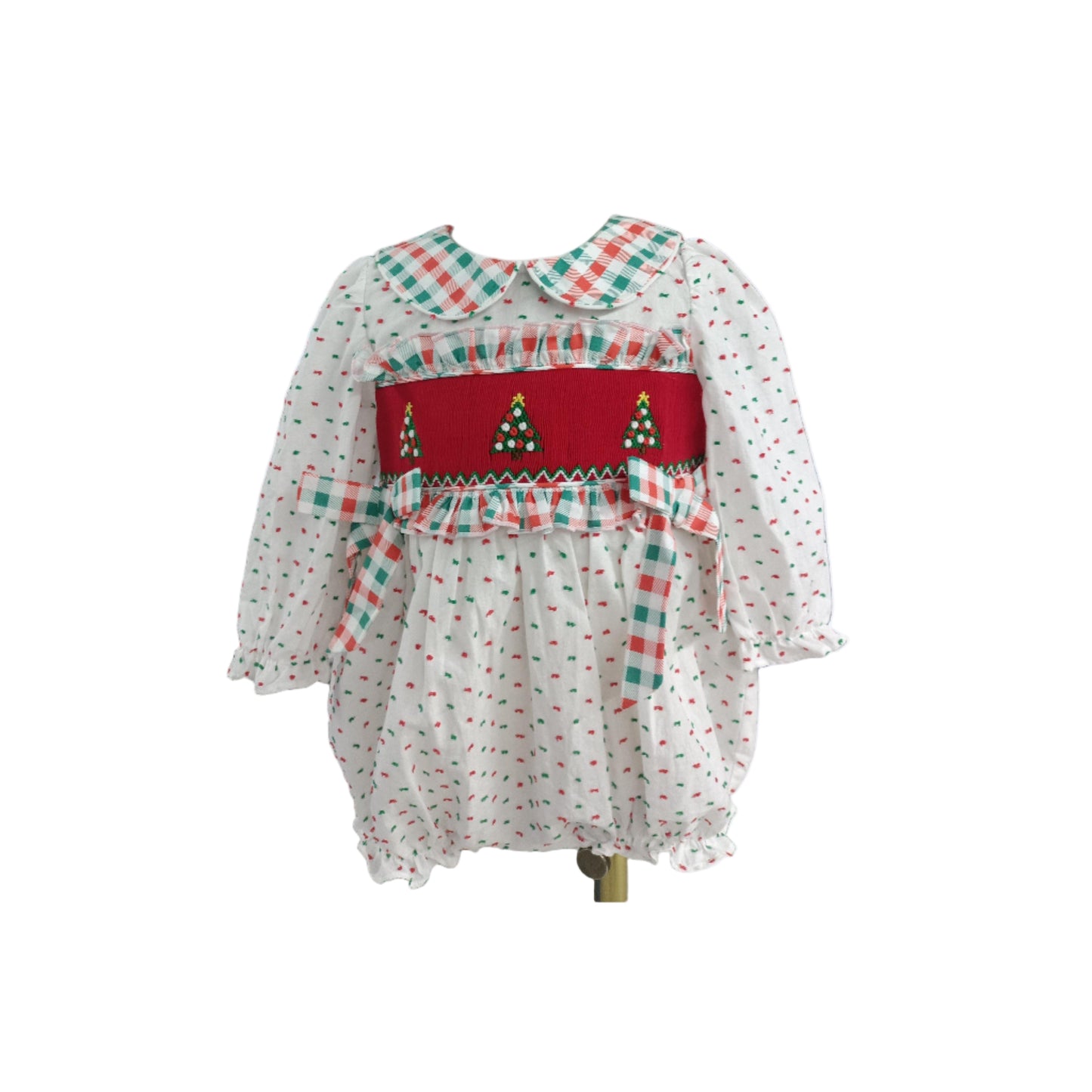 Girls Hand Smocked Swiss Dot Christmas Tree Bubble romper featuring a red smocked bodice with embroidered trees and a plaid Peter Pan collar.