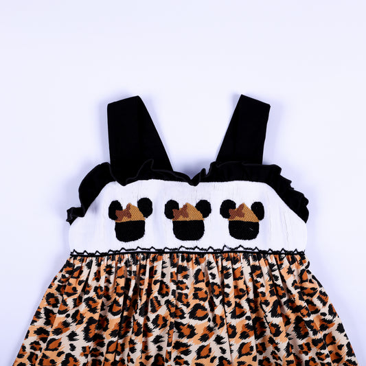 Front bodice view of a girls safari mouse hand smocked dress showing hand embroidered safari mouse motifs.