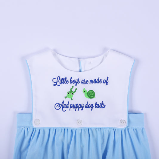 Close-up front chest section of baby boy light blue bubble showing embroidered frogs and snails rhyme.