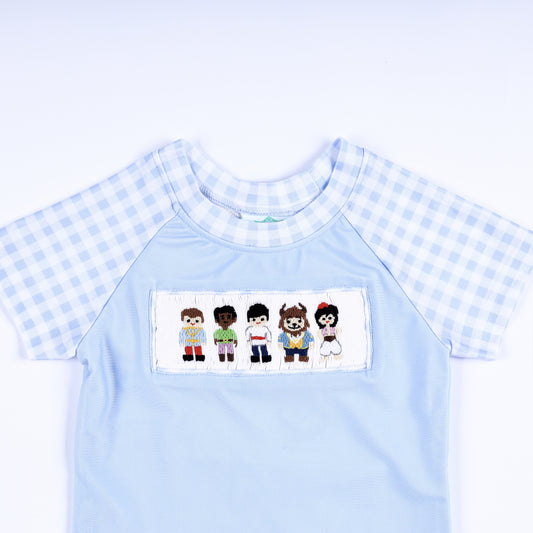 Boys light blue rash guard shirt featuring hand smocked prince embroidered chest plate and gingham short sleeves.