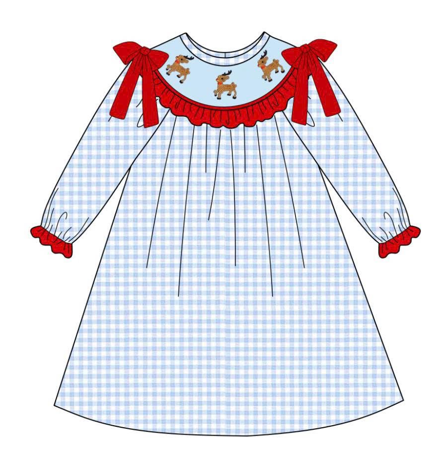 Girls hand smocked blue gingham dress with red bows and trim, featuring embroidered reindeer smocking for Christmas.