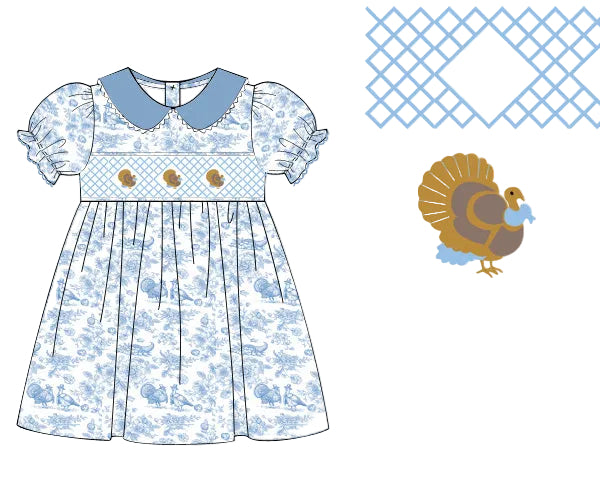 Grandmillennial blue toile turkey hand smocked woven girl dress with a solid blue collar and puff sleeves.