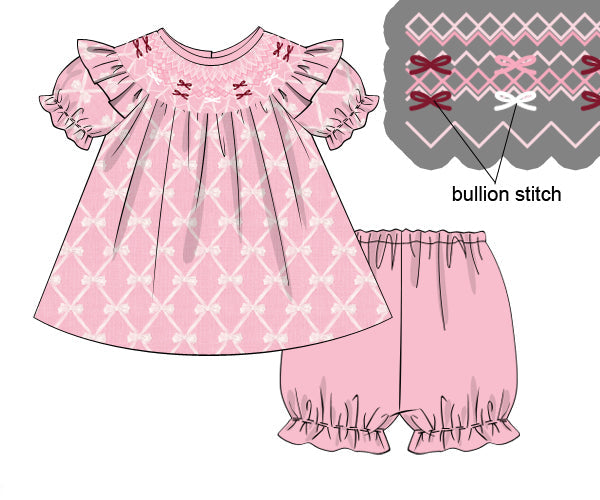 Pink hand-smocked girls' dress and bloomer set with white bow trellis pattern and maroon bullion stitch details.