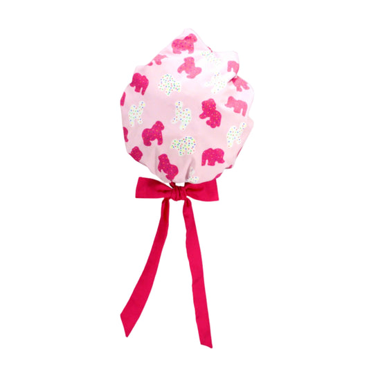 Pink Frosted Animal Cookie Sun Bonnet with hot pink ribbon ties and scalloped brim in Grandmillennial style.