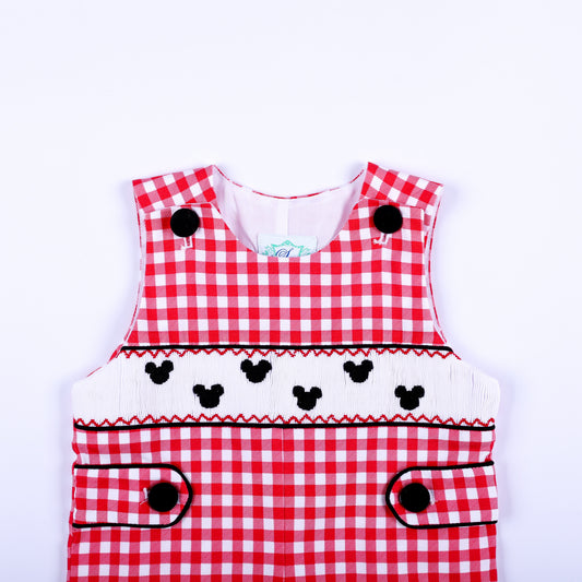 Upper bodice view of boys red gingham jon jon showing hand smocked white band with black embroidered mouse motifs.