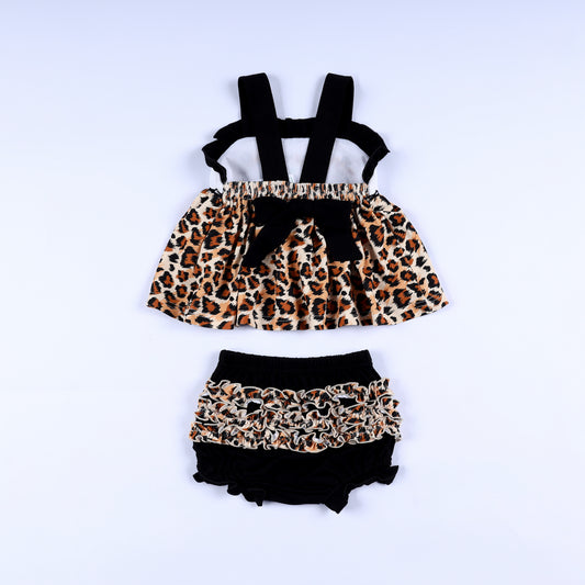 Back view of animal kingdom print safari mouse smocked top with black tie bow and matching ruffled bloomer set.