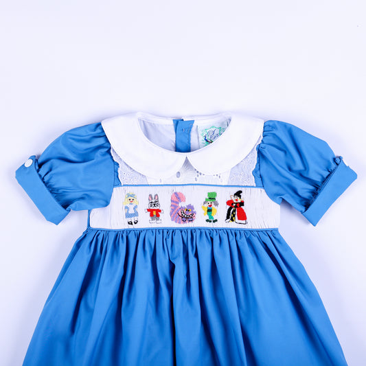 Front bodice view of storybook wonderland blue hand smocked dress featuring classic character embroidery.