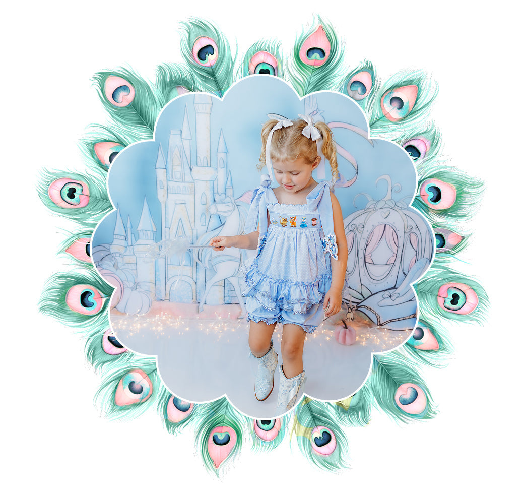 Girl in smocked blue sunsuit set with castle background for the girls sets collection.