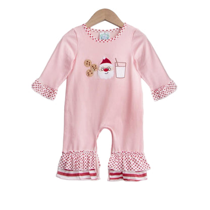 Pink Girls Milk and Cookies with Santa Christmas Romper featuring a festive appliqué, red polka dot ruffles on the sleeves and legs, and striped hem details.