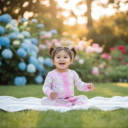 EVERLY’S FLOWERS RUFFLE BUTT FOOTIE SLEEPER