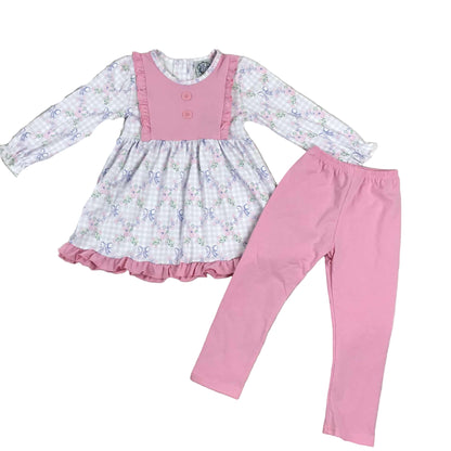 Grandmillennial Floral Girls Bow Pants Set featuring a long-sleeve grey gingham and floral print tunic with pink ruffled bib details and matching solid pink leggings.