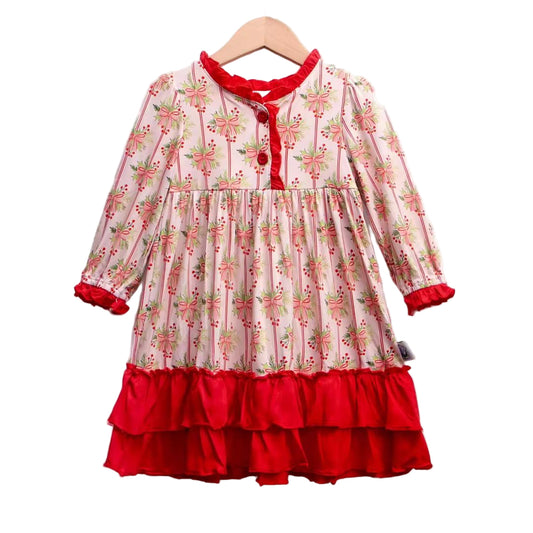 Girls long sleeve Christmas nightgown featuring a festive holly berry and pink bow print on a striped background, accented with bright red ruffle trim on the neckline, cuffs, and a double-tiered hem.