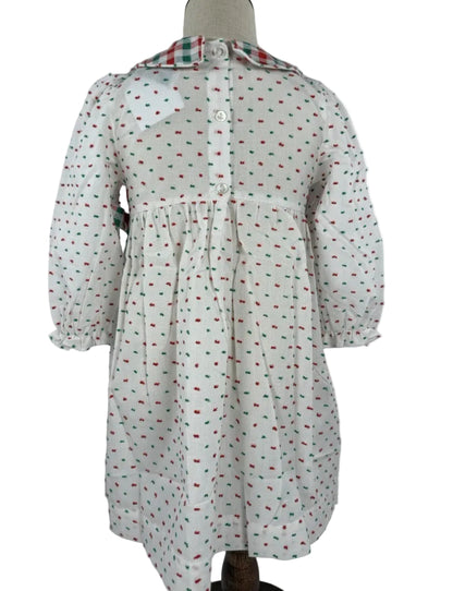 Back image of a white hand smocked dress featuring red and green Swiss Dot fabric, perfect for Christmas.