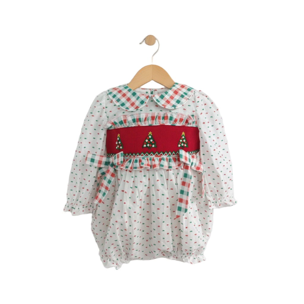 Girls Hand Smocked Swiss Dot Christmas Tree Bubble romper featuring a red smocked bodice with embroidered trees and a plaid Peter Pan collar.