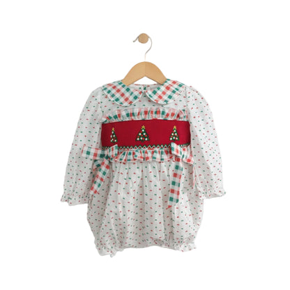 Girls Hand Smocked Swiss Dot Christmas Tree Bubble romper featuring a red smocked bodice with embroidered trees and a plaid Peter Pan collar.