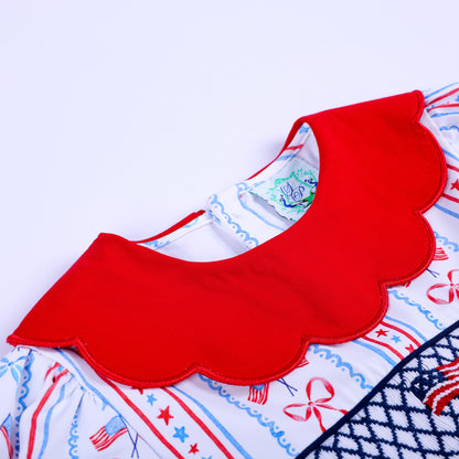 Red scalloped collar detail on America the Beautiful hand smocked and embroidered patriotic bloomer diaper set.