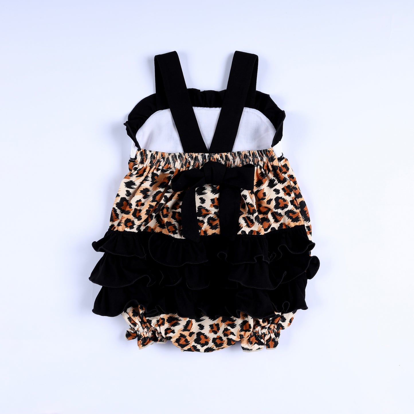 Back view of safari mouse leopard smocked baby bubble with black shoulder straps and layered ruffle bum.