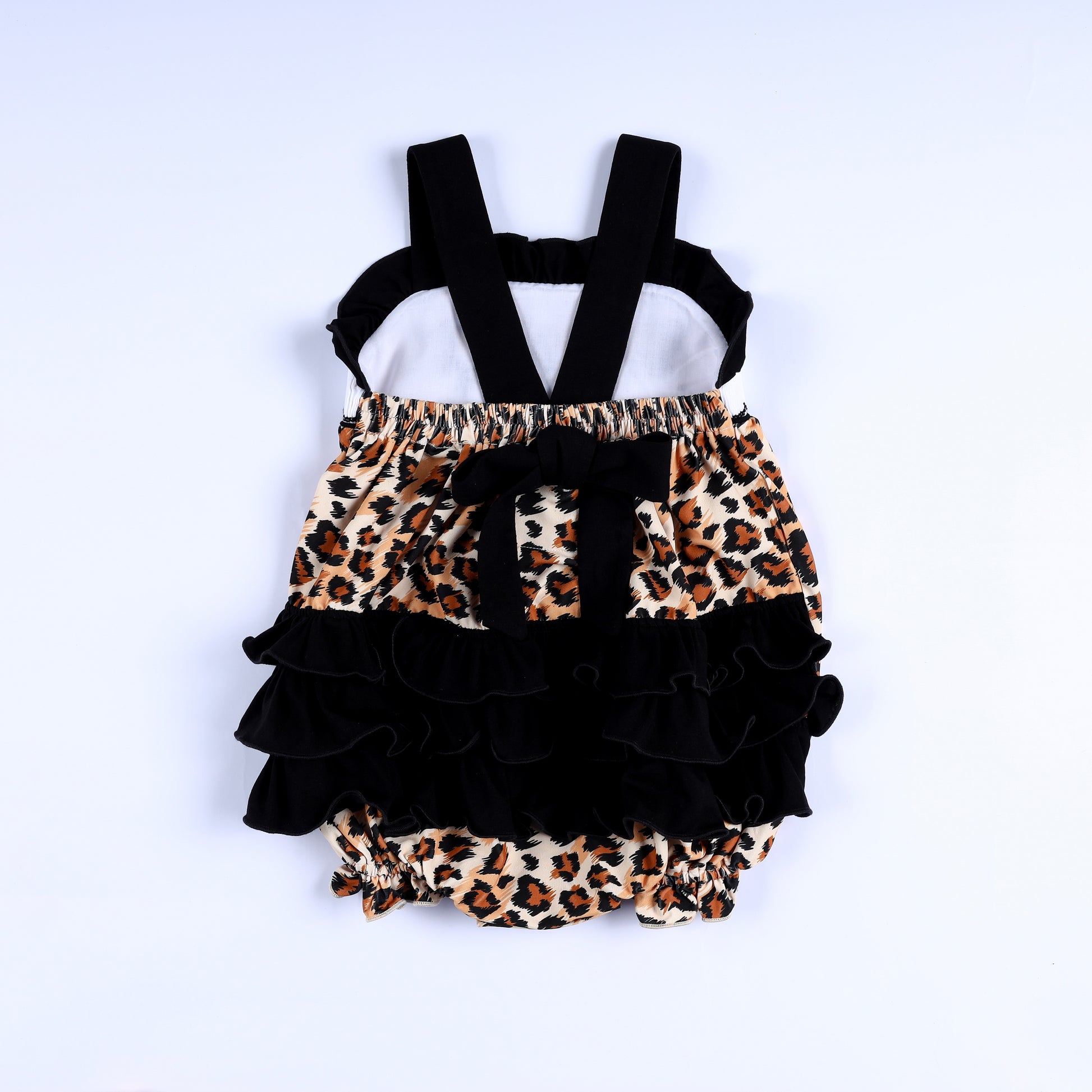 Back view of safari mouse leopard smocked baby bubble with black shoulder straps and layered ruffle bum.