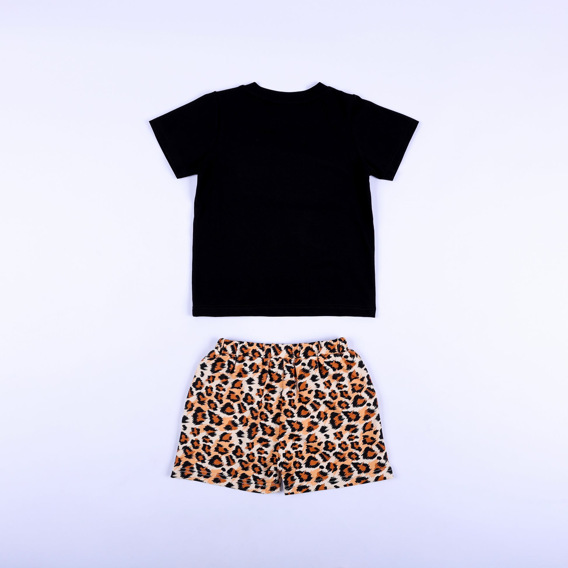 Back view of boys two-piece safari outfit featuring black short sleeve t-shirt and leopard print shorts.