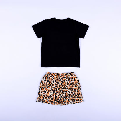 Back view of boys two-piece safari outfit featuring black short sleeve t-shirt and leopard print shorts.