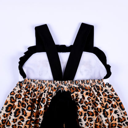 Back bodice close up view of a safari mouse hand smocked dress showing black criss cross straps and tie bow.