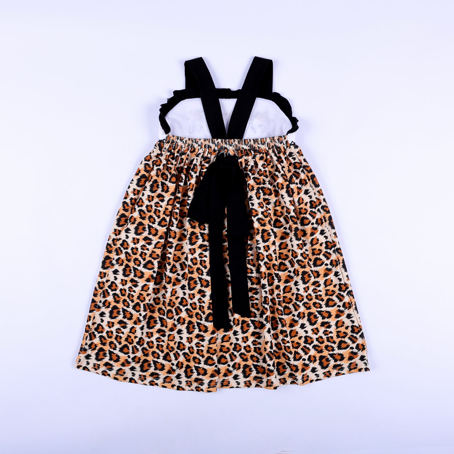 Full back view of a girls animal print safari mouse hand smocked dress showing criss cross straps and bow.