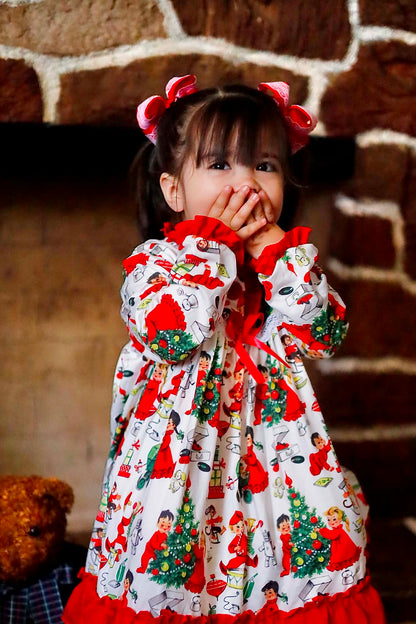Toddler girl wearing Antique Christmas Morning Child's Play Nightgown covering mouth in excitement by fireplace.