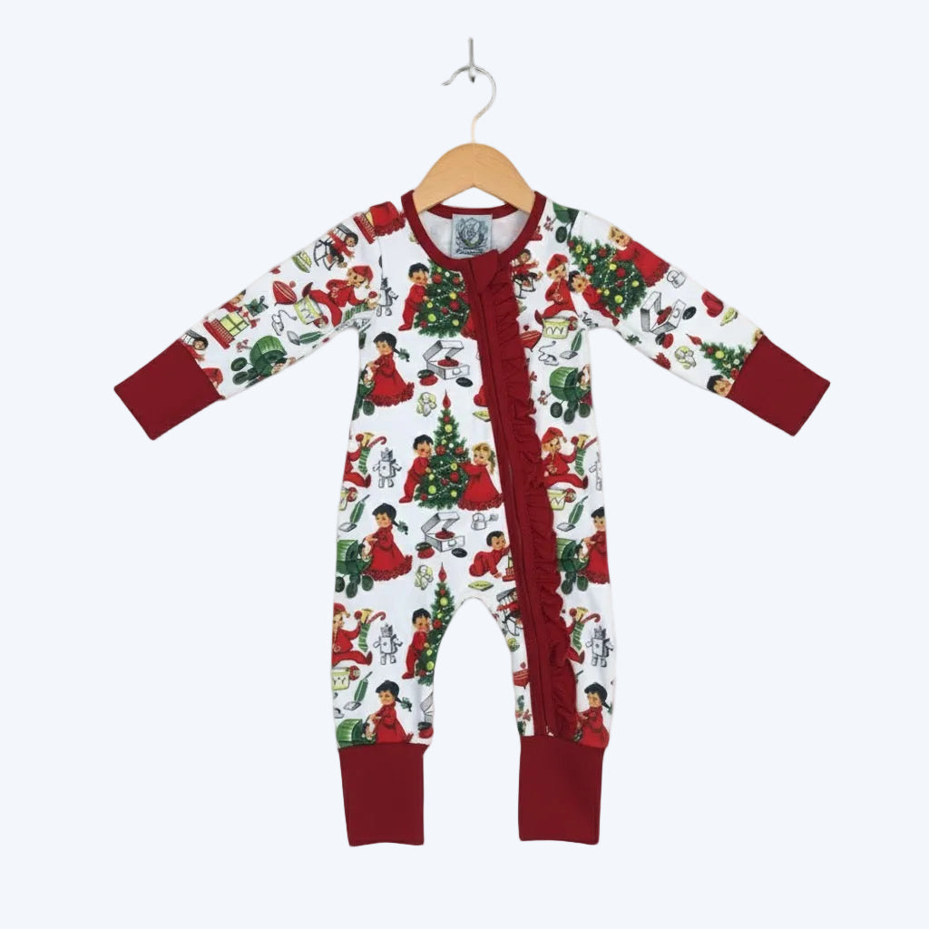Antique Christmas Morning Child's Play Zippy hanging on wooden hanger with retro holiday print and red trim.
