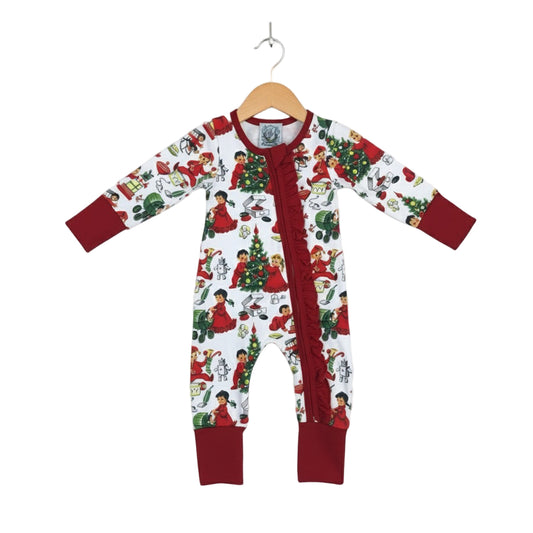 Antique Christmas Morning Child's Play Zippy hanging on wooden hanger with retro holiday print and red trim.
