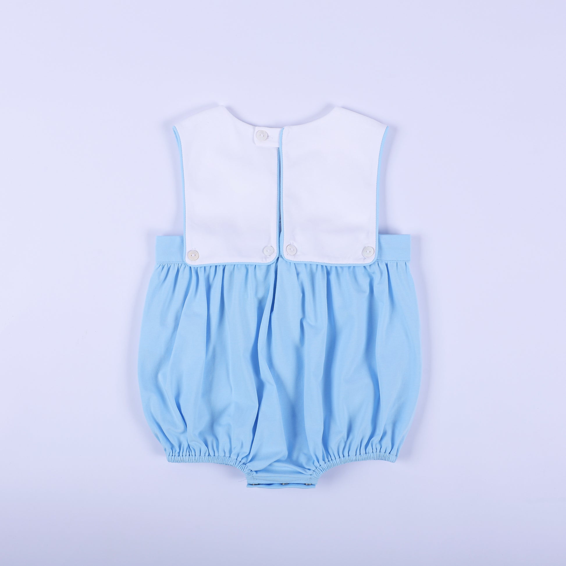 Full back view of light blue classic baby boy bubble romper featuring white top panel with button closures.