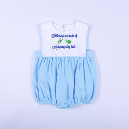 Front view of light blue baby boy embroidered bubble romper featuring nursery rhyme frog and snail yoke.