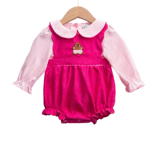 Baby girl pink corduroy bubble romper with gingerbread appliqué and pink long-sleeve top set on a hanger.