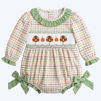 Baby girl Thanksgiving smocked plaid bubble romper featuring embroidered turkeys and pumpkins on the chest