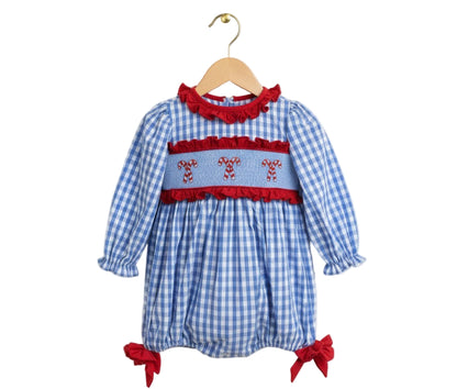 Blue gingham girls bubble romper with hand-smocked Christmas candy canes, red ruffle trim, and leg bows.