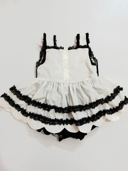 Full back view of baby girls Halloween bubble romper showing button placket and tiered skirt