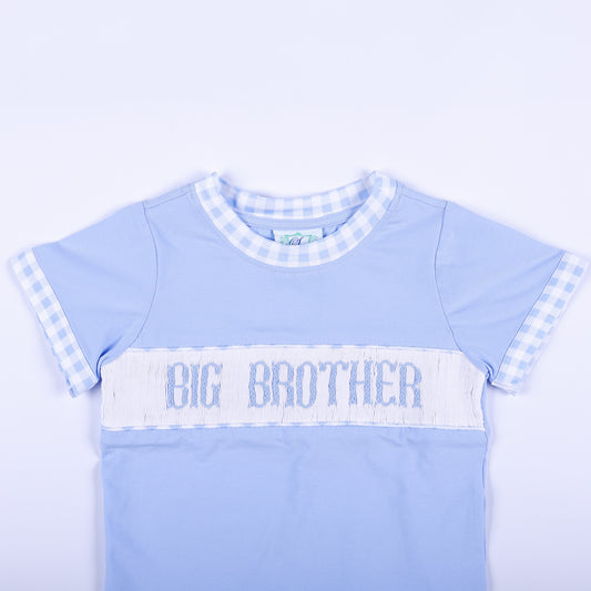 Close-up of light blue shirt featuring hand smocked Big Brother embroidered text panel and gingham collar trim.