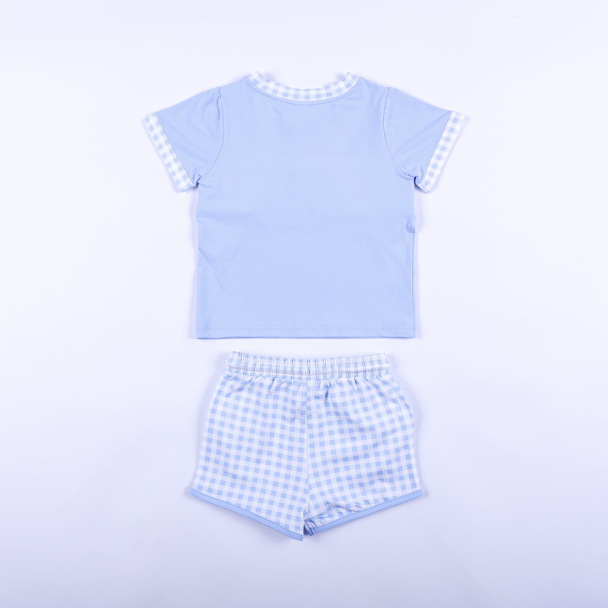 Back view of boys light blue Big Brother set with solid blue shirt back and matching gingham shorts outfit.