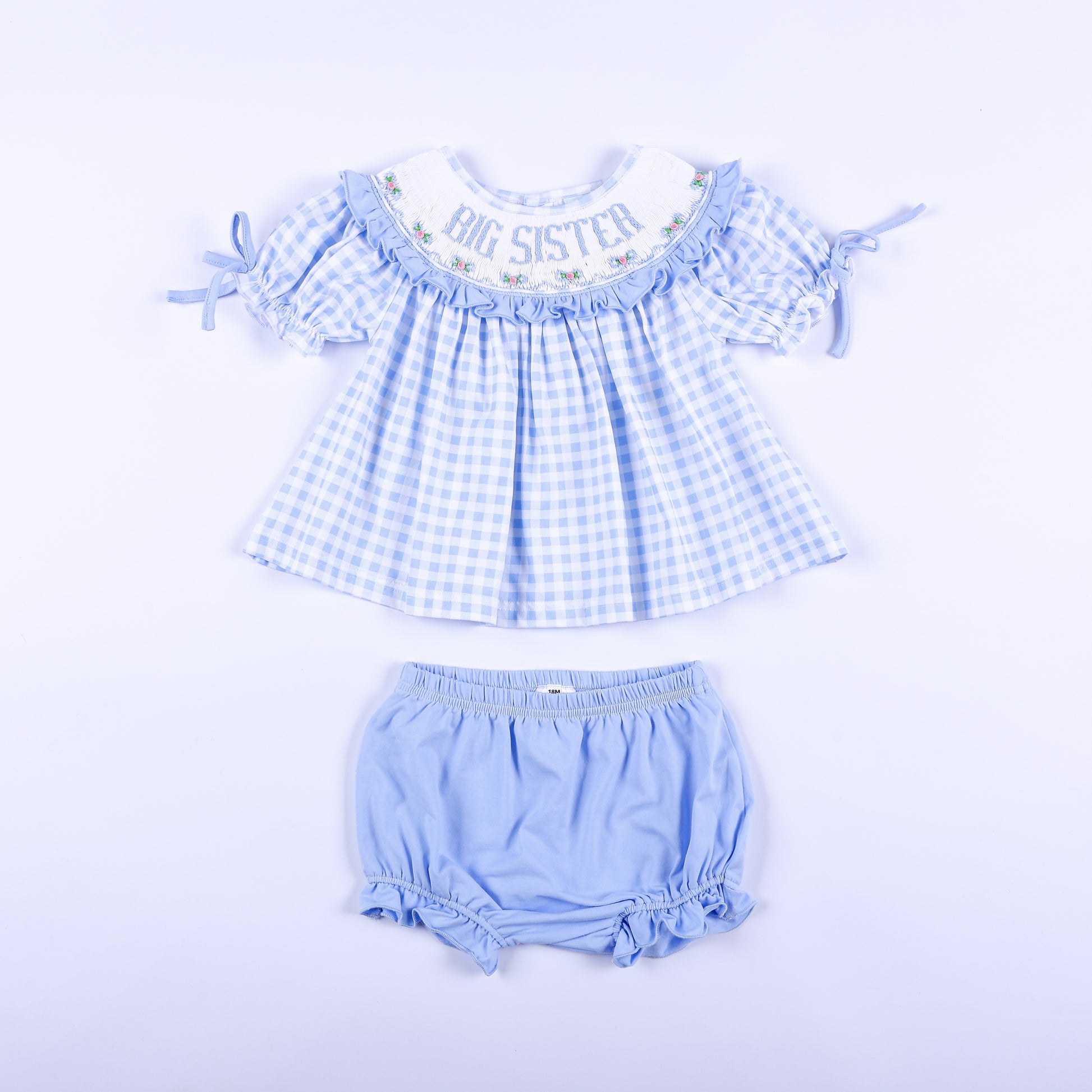 Blue gingham hand-smocked Big Sister top and matching light blue diaper cover bloomer set for babies.