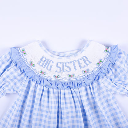 Detailed front smocked collar reading Big Sister with delicate floral hand embroidery on blue gingham.