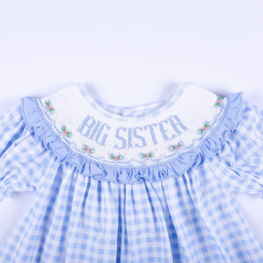 Detailed front smocked collar reading Big Sister with delicate floral hand embroidery on blue gingham.