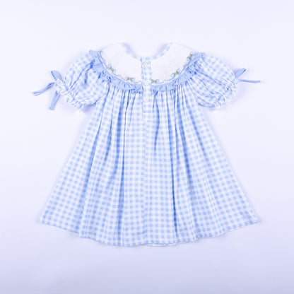 Back view of the light blue gingham Big Sister hand-smocked dress showing classic button closure details.