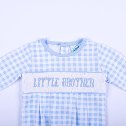 Close up of hand smocked chest bodice on blue gingham baby boy sleep sack layette with Little Brother text.