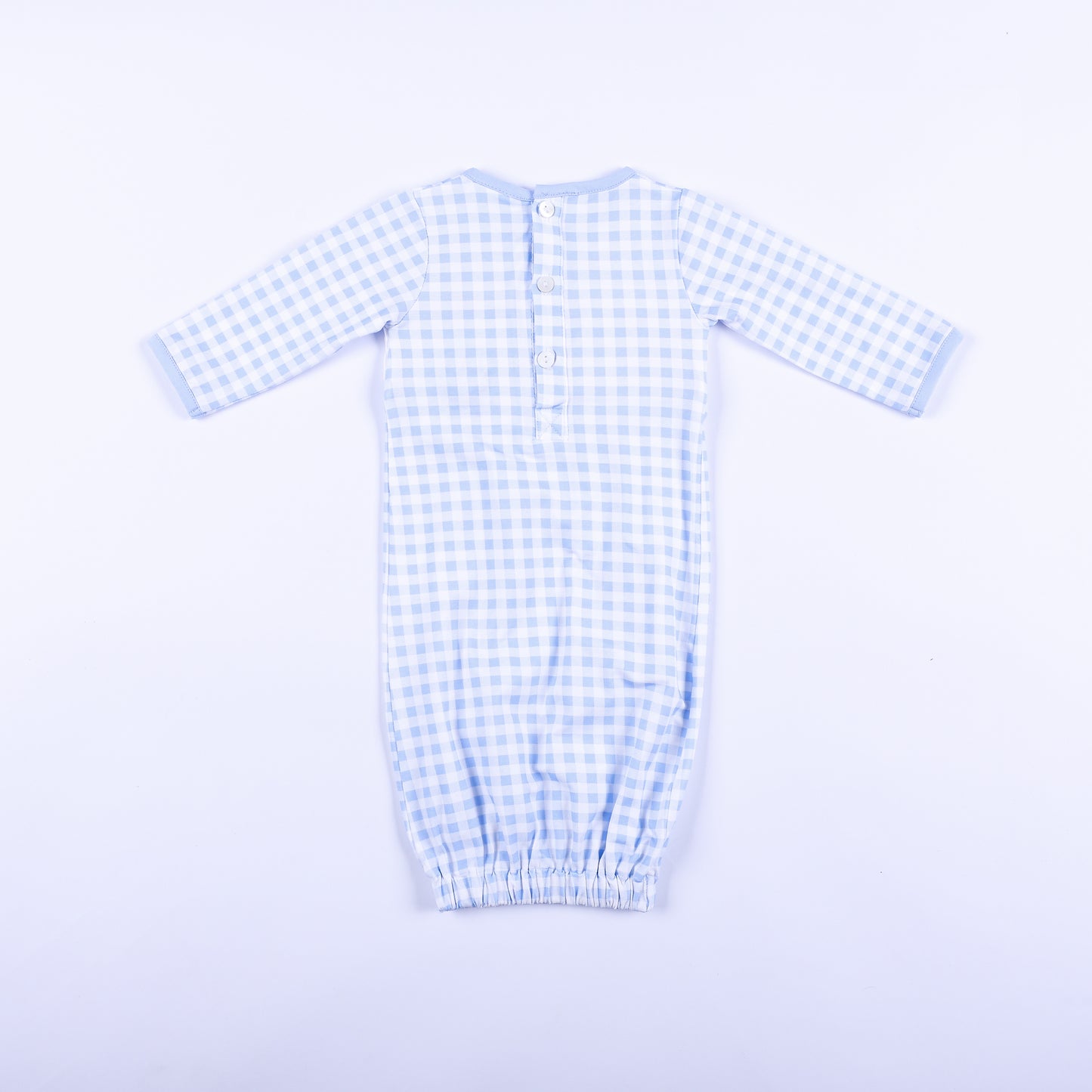 Full back view of light blue gingham baby boy sleep sack layette gown showing back button placket closure.