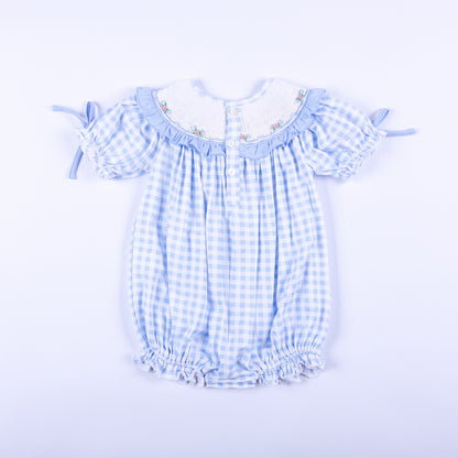 Full back view of light blue gingham hand-smocked Little Sister bubble romper showing back button closure.
