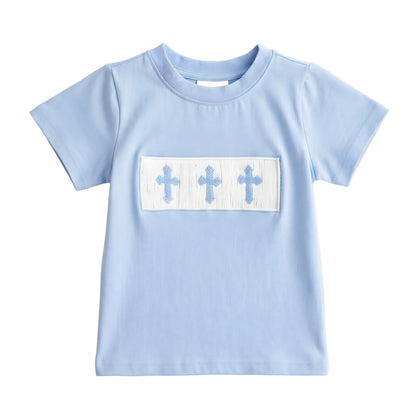 Boys light blue t-shirt with hand smocked white panel featuring three blue crosses for Easter.