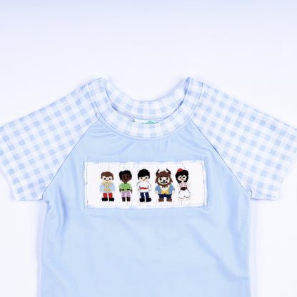 Boys light blue rash guard shirt featuring hand smocked prince embroidered chest plate and gingham short sleeves.