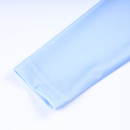 Detail of light blue long sleeve cuff stitching on boys handsome prince hand smocked one piece rash guard swimsuit.
