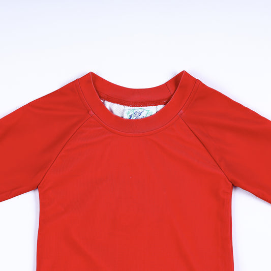 Close-up view of the durable crew neckline and stitching on the boys red long sleeve swimwear rash guard.