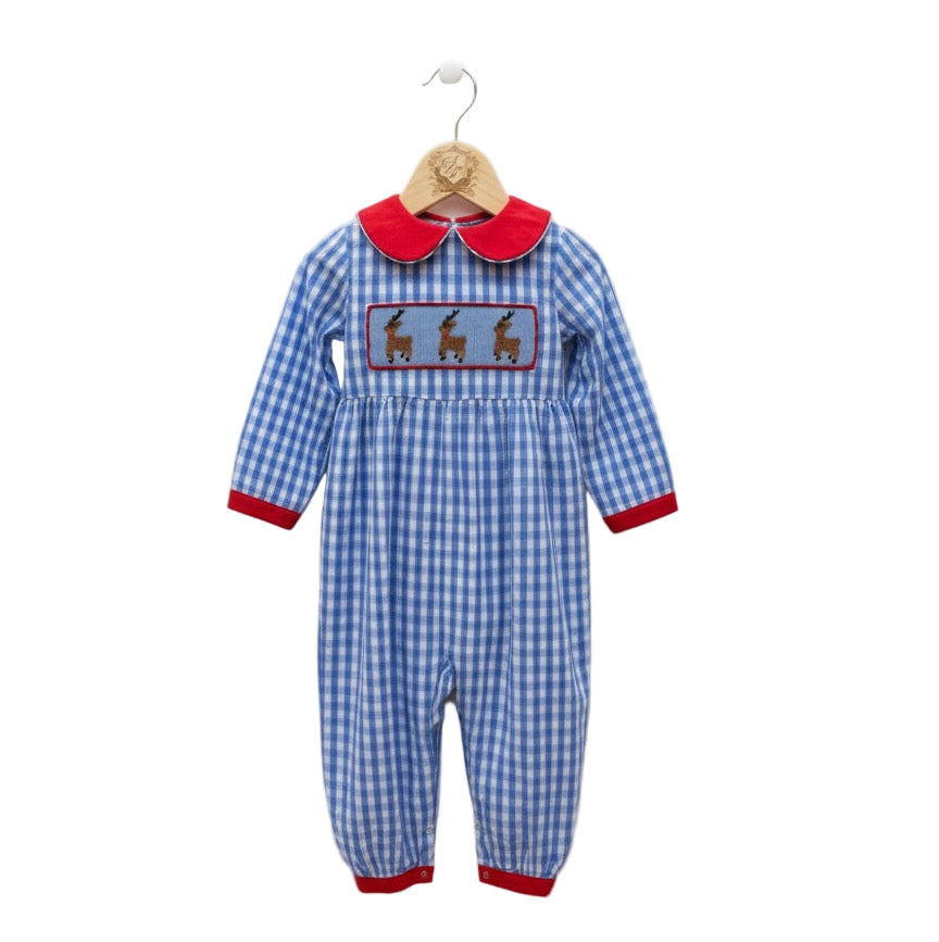 Hand smocked boys romper in blue gingham with red collar, cuffs, and three embroidered reindeer on the chest.